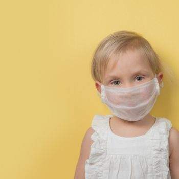 child wearing covid mask